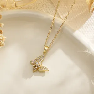 Detailed view of an exquisite golden butterfly pendant inlaid with sparkling cubic zirconia stones