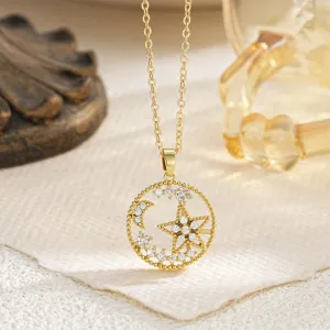 Close-up of a gold-plated rotating star and moon pendant necklace with clear cubic zirconia.