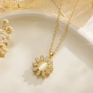 Detailed view of a golden rotatable sunflower fidget necklace with cat's eye stone center