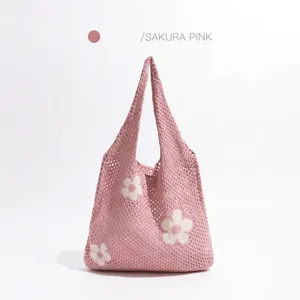 Bolso shopper de punto calado rosa sakura con flores blancas para compras de verano