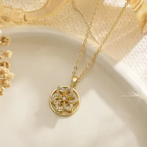 Detailed view of a golden hollow flower pendant necklace featuring shimmering zircon stones