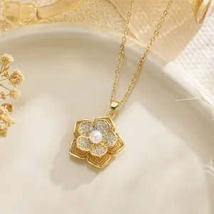 Close-up detail of golden rotatable flower fidget pendant with crystals and pearl