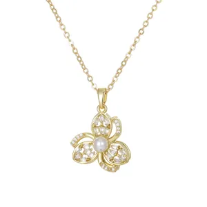 Elegant gold floral pendant necklace with central pearl and sparkling crystal accents