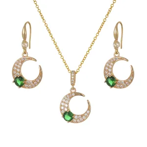 Gold plated necklace and earring set with emerald green zircon crescent moon pendant.