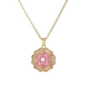 Elegant gold necklace with pink enamel camellia flower pendant and zircon center