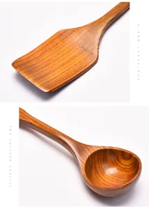 Close-up detail of large wooden soup spoon and cooking spatula with natural grain texture