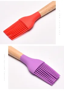 Detailed macro view of red and purple silicone basting brushes with natural wooden handles
