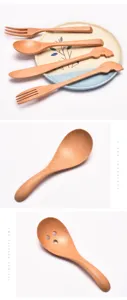 Vista detallada del juego de cuchara y tenedor de madera para niños con mangos