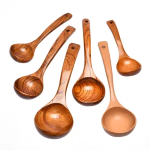 Natural wooden soup spoons with long handles in various grain patterns