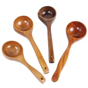 Set of four long-handled wooden spoons with natural grain for home cooking and serving.