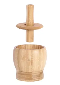 Detailed view of bamboo mortar and pestle set showing natural wood grain and lid