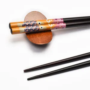 Premium Japanese style pointed wooden chopsticks with colorful fish pattern and rest