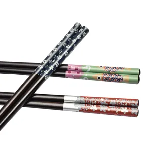 Japanese style pointed wooden chopsticks featuring colorful floral and fish print patterns