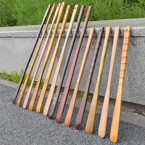 Set of long wooden shoehorns in various natural wood finishes for easy shoe wearing