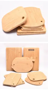 Collection of various bamboo cutting board shapes including a cute fish design
