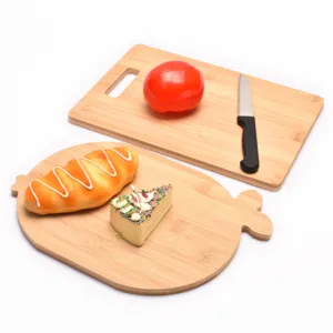 Set of two eco-friendly bamboo cutting boards with a cartoon shape for food prep