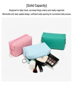 Close-up of portable PU leather makeup bags in pastel colors showing large capacity
