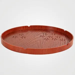 Elegant round wooden tray with floral carvings in Japanese style for serving