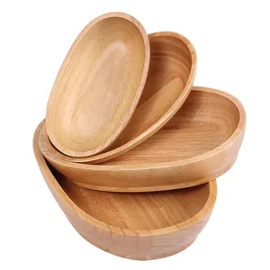 Set of four Japanese-style boat-shaped wooden fruit trays for snacks and dim sum