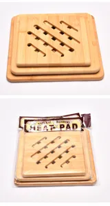 Detailed view of three stacked bamboo heat pads with hollowed diagonal stripes and packaging