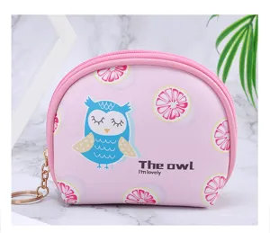 Detailed view of pink mini coin purse featuring a cute owl design and golden keychain