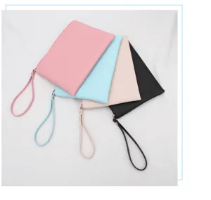 Detailed view of four colorful waterproof PU leather cosmetic pouches with wrist straps