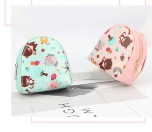 Detailed view of mint green and pink shell-shaped cartoon print coin purses