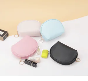 Group of colorful semi-circular waterproof makeup bags with cosmetic props