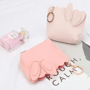 Cute pink bunny ear coin purse with scalloped edges and golden keychain ring attachment