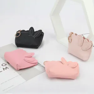 Adorable mini rabbit ear coin purse with scalloped edges and gold keychain ring