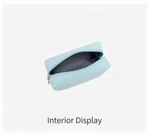Detailed view showing the spacious grey interior of the light blue PU cosmetic bag
