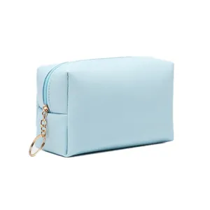 Borsa da trucco professionale in pelle PU azzurra impermeabile con cerniera a cerchio dorata
