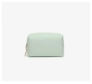 Close-up of a mint green PU leather waterproof travel makeup storage bag for women