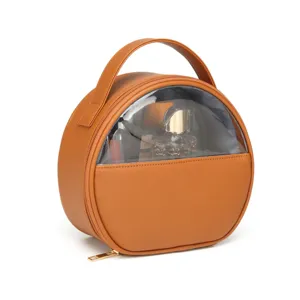 Waterproof round brown makeup bag with top handle and clear window for easy travel storage