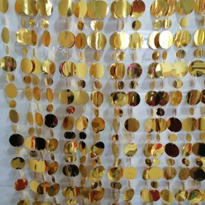 Gold sequin curtain detail close up hanging wedding party backdrop decor items