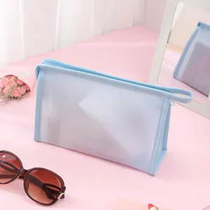 Stylish translucent light blue PVC waterproof makeup bag for travel and daily cosmetic storage