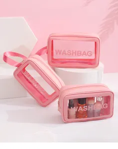 Set roze transparante reistoilettassen voor cosmetica met minimalistische rits