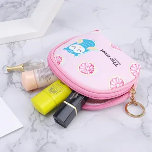 Cute pink owl pattern mini storage pouch for coins and cosmetics on marble background