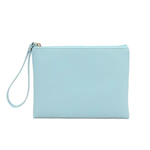 Elegant waterproof PU leather cosmetic bag with wristlet strap in light baby blue finish