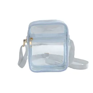 Clear waterproof PVC crossbody bag in light blue with adjustable strap and gold zipper