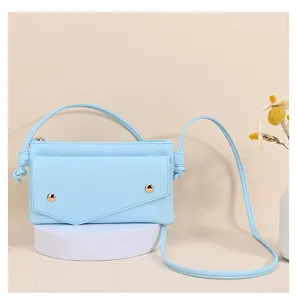 Minimalist light blue textured leather crossbody bag for phone and cards with gold studs