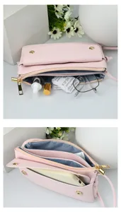 Detailed view of pink crossbody bag interior compartments and front phone pocket.
