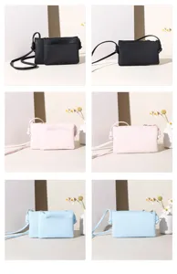 Detailed view showing minimalist PU leather crossbody bags in black, soft pink, and light blue colors