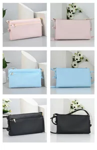 Stylish minimalist PU leather crossbody phone bags in pink, light blue, and black