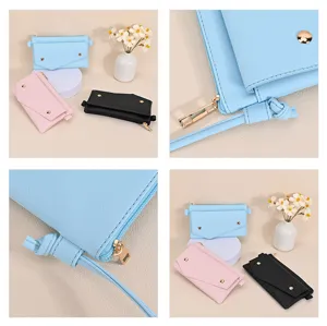 Detailed view of saffiano leather crossbody phone bag with gold zipper and button