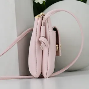 Pink faux leather mobile phone crossbody bag with multi-layer structure side view
