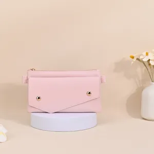 Elegant pink Saffiano leather crossbody phone bag for women decorated with gold studs