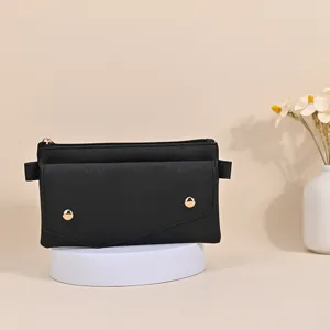 Minimalist black textured leather crossbody phone bag for women featuring gold studs