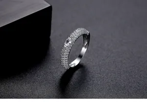 Macro view of micro-pave cubic zirconia stones on an elegant silver wedding ring