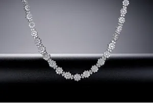 Close-up of silver floral necklace with sparkling cubic zirconia for bridal jewelry.